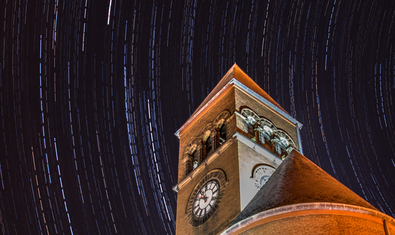 old main at night with star trail