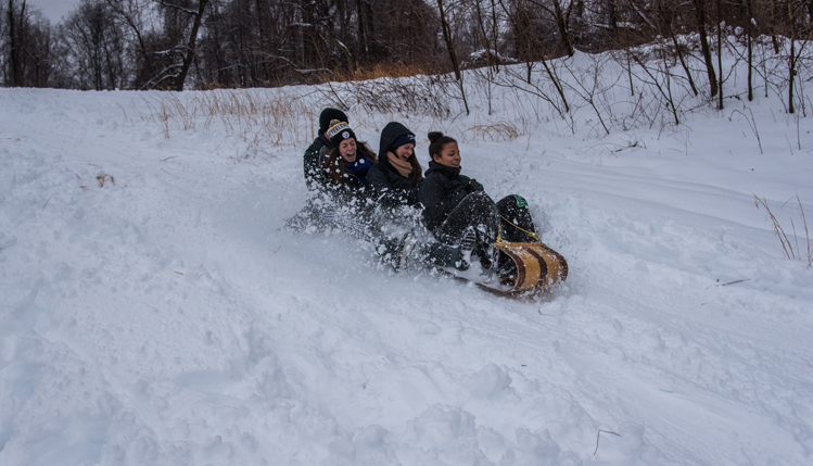 students sledding
