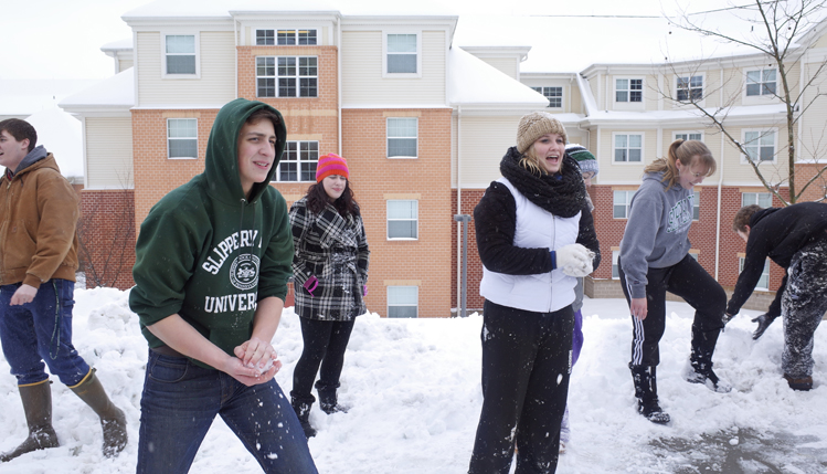 Students having fun in snow
