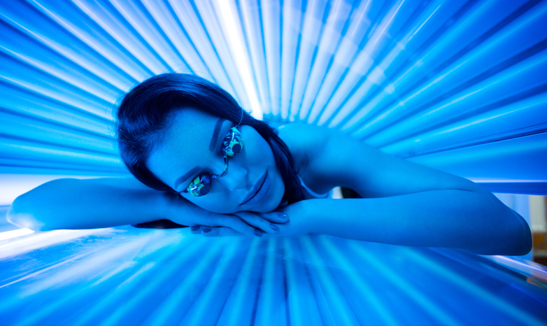 woman laying in tanning bed