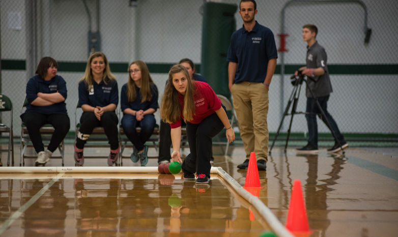 Slippery Rock University students in the adapted physical activity graduate program are coaching indoor bocce