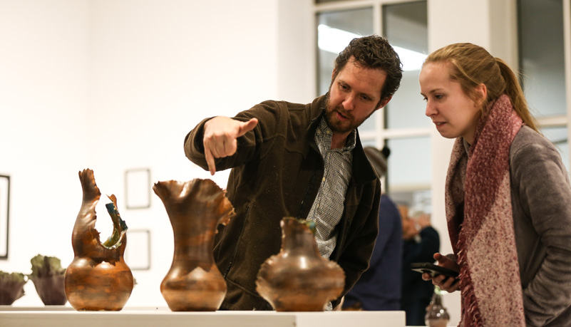 Man and woman looking at ceramics