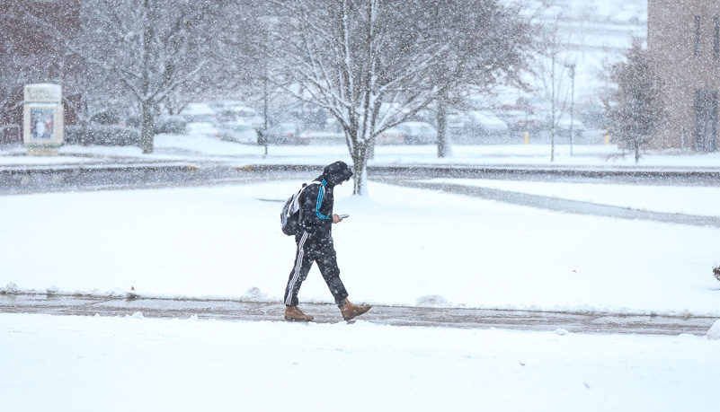 Student walking in the snow