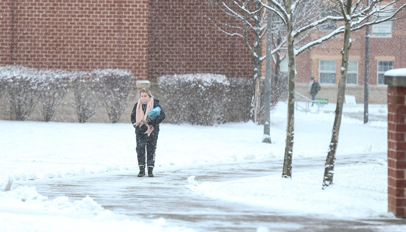 Student walking through the snow