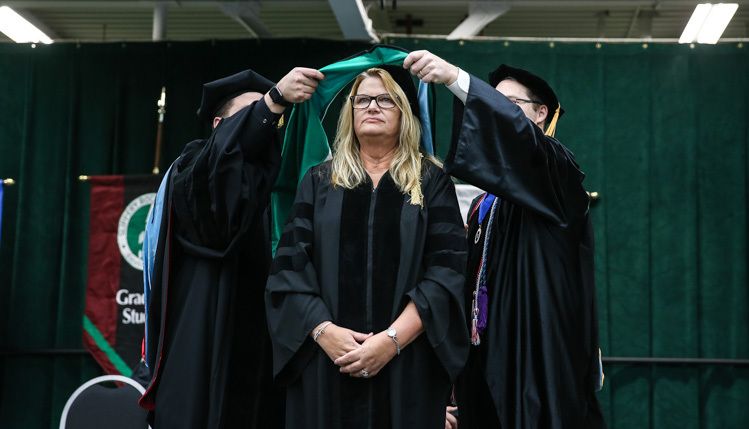 Doctorate candidate receives her hood