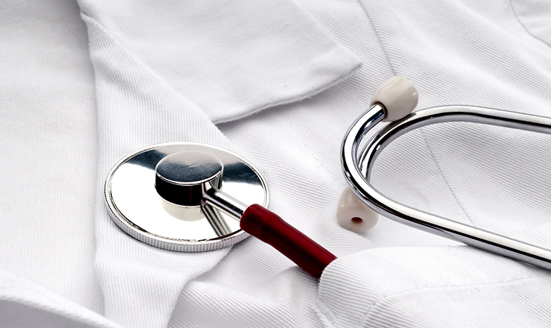 physician's white lab coat and stethescope
