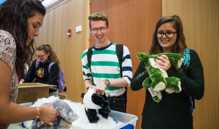 Students put stuffing in stuffed animal