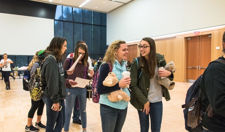 Students enjoy coffee with their stuffed animals