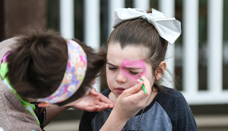 Girl getting her face painted