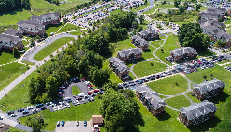 An aerial view of cars waiting in line