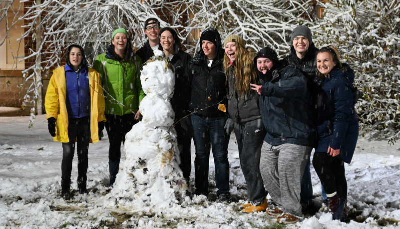 Students building a snow man
