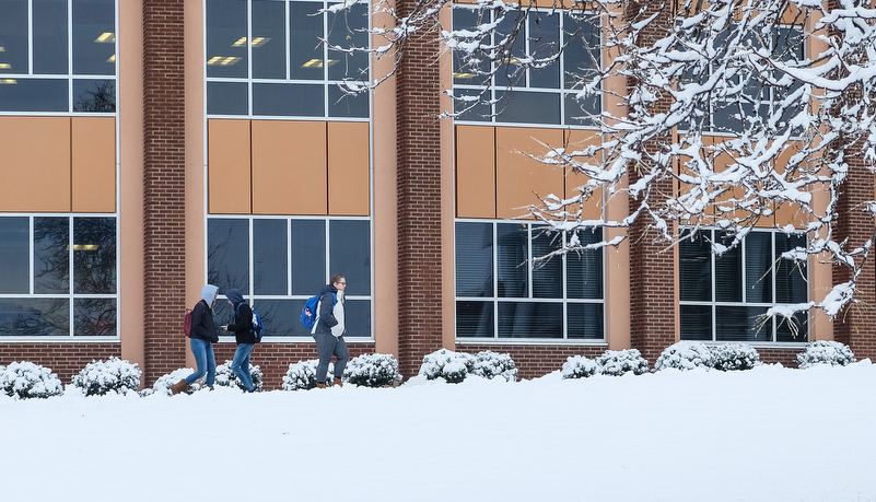 Students walking to classes in front of Vincent Science building