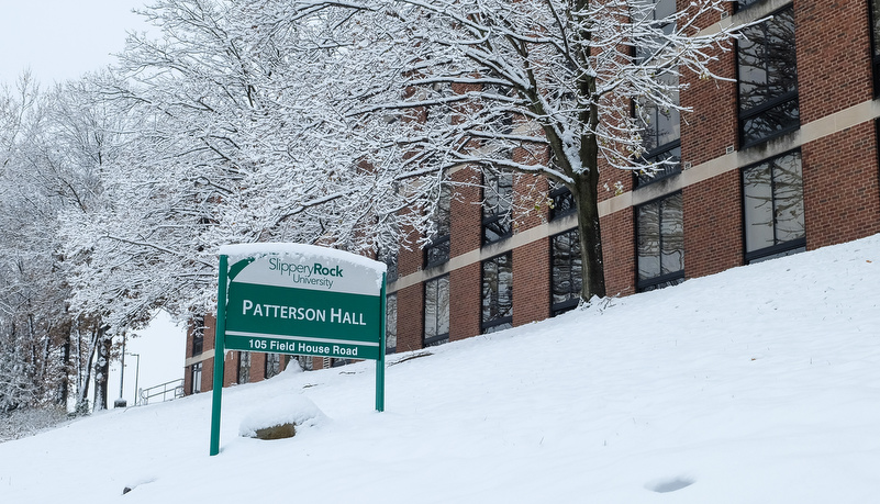 Campus sign covered in snow