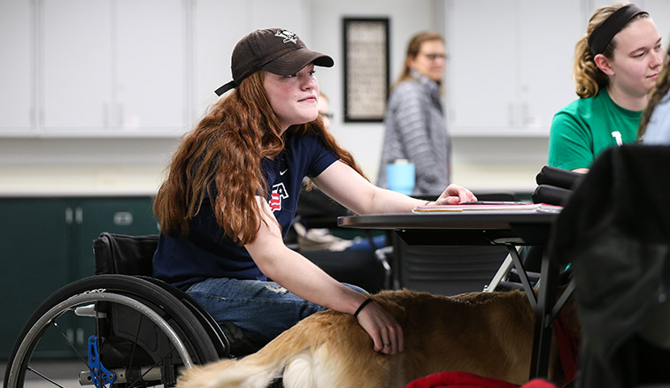 Female student with disabilities in a classroom