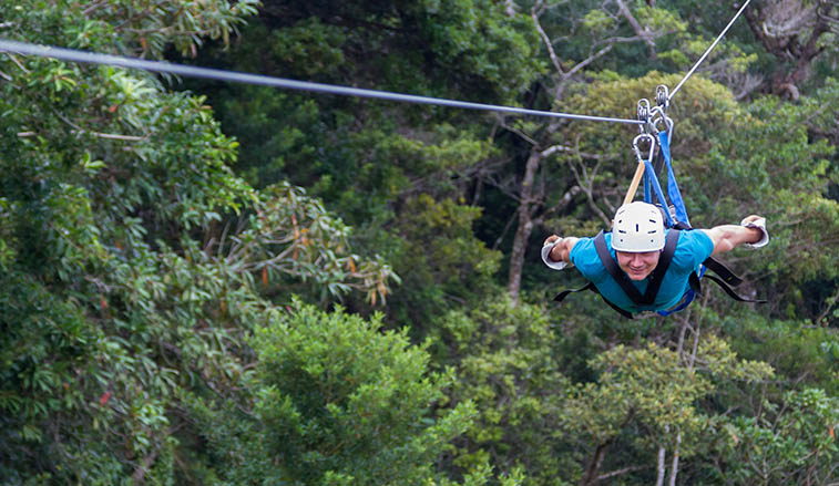Man on a zip line in Costa Rica