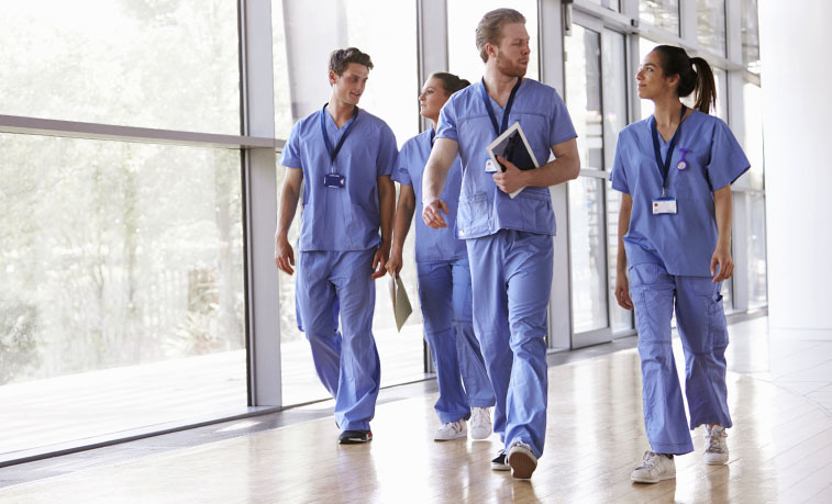 Nurses walking down a hall