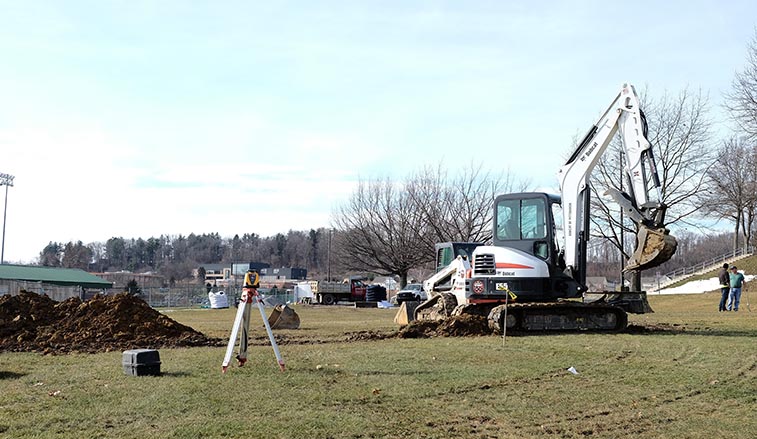 Construction equipment preparing the new parking lot