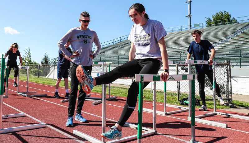 students doing drills for hurdling