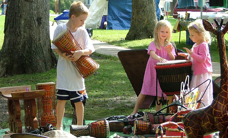 Children experimenting with music instruments