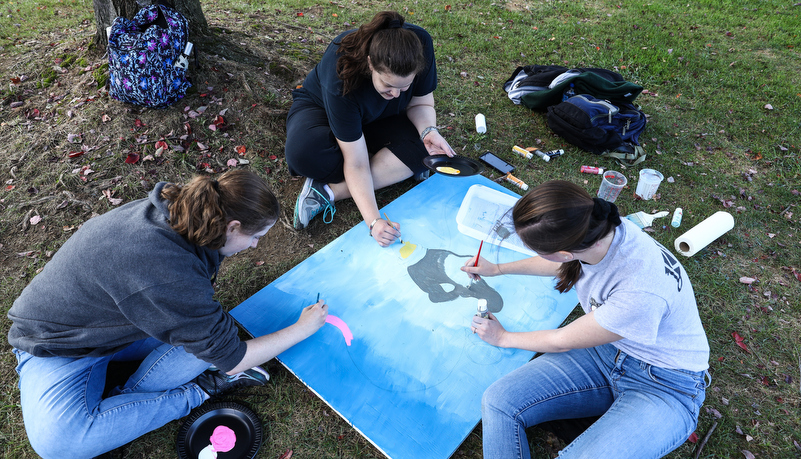 Students painting spirit boards
