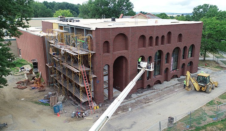 Masonry on the perfoming arts center is wrapping up