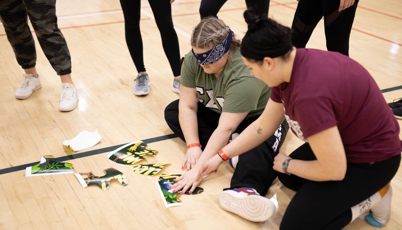 Blindfolded students playing a game