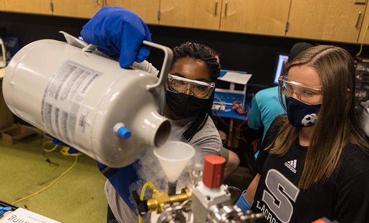 Students pour liquid nitrogen
