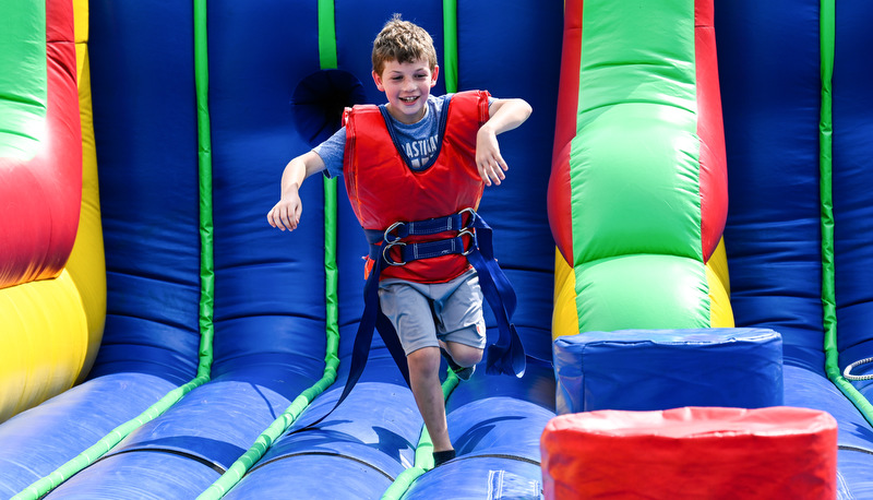 Boy playing on a bouncy house