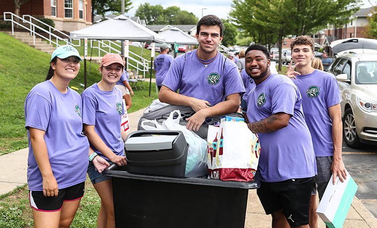 Students helping with first year student move in