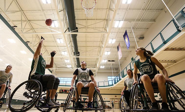 Students playing wheelchair basketball