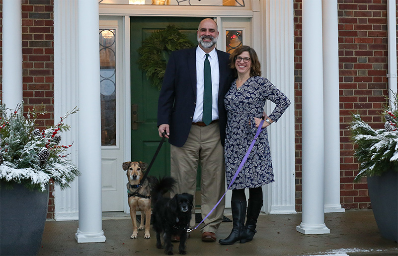 President Bill Behre and Leah Ingram and two dogs