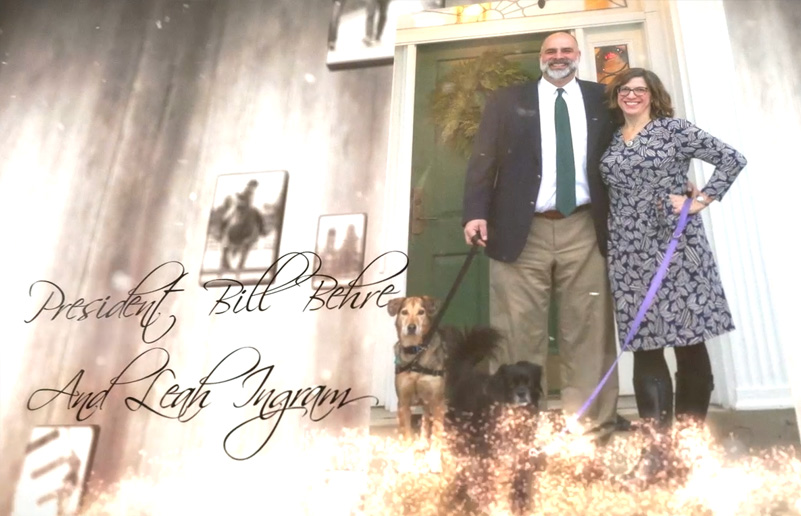 President Bill Behre and Leah Ingram with two dogs