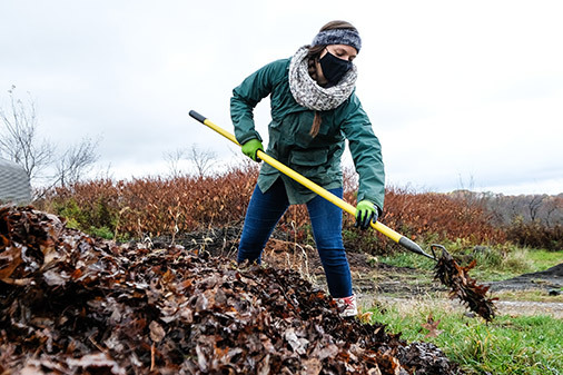 Macoskey Center staff turning the leaves