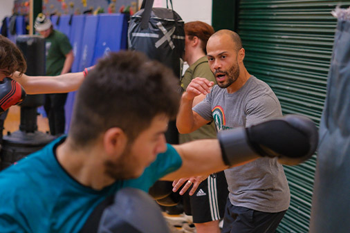 Professor giving a boxing lesson