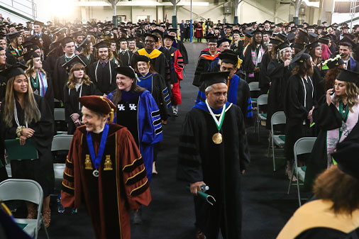 Students and professors entering commencement