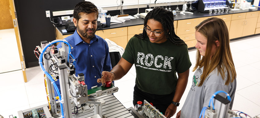 Students working with an engineering professor