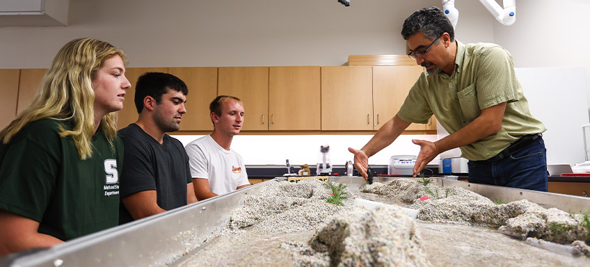 Students working with a professor