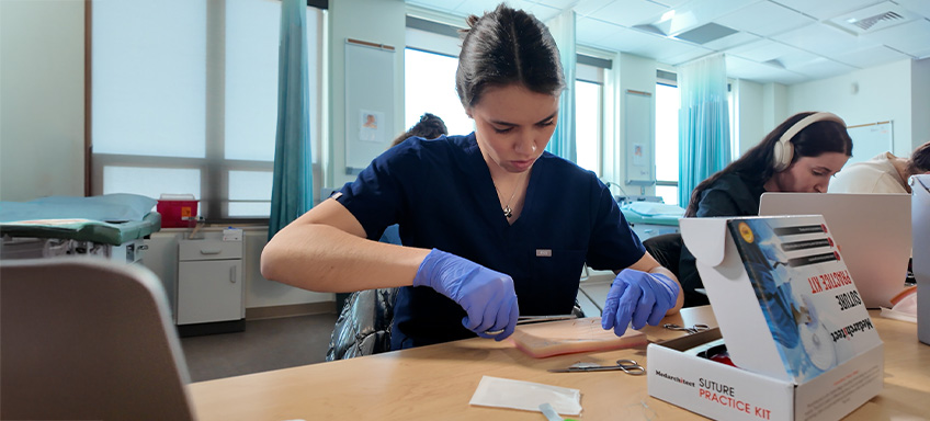 Student practicing sutures