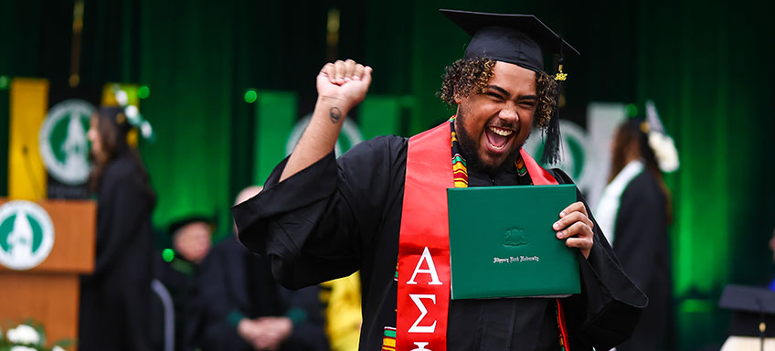 Student at commencement graduating