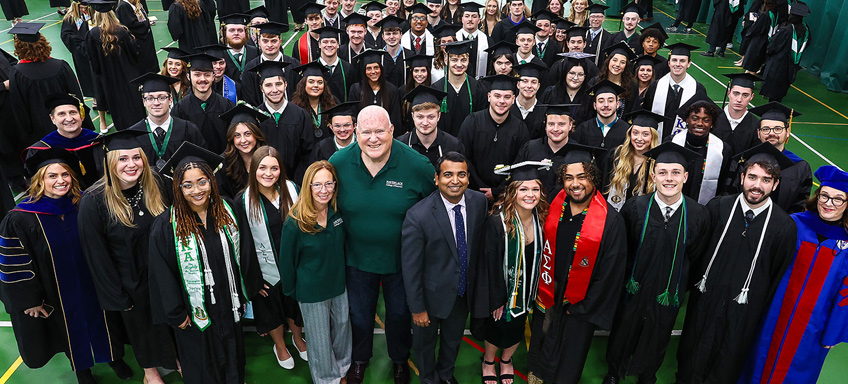 Haverlack and individuals at a commencement