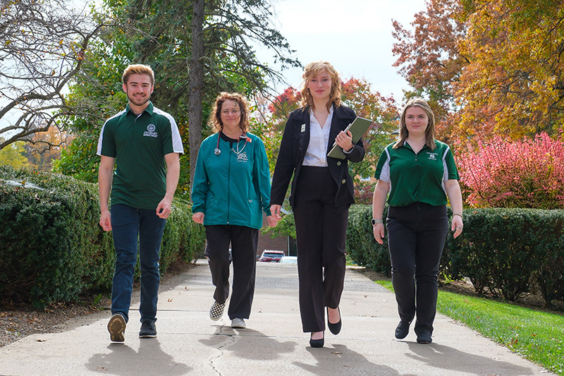 4 SRU workers walking with determination.