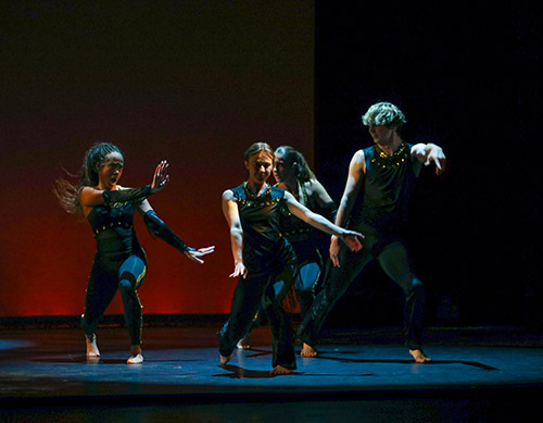 Four SRU students doing a performative dance on stage