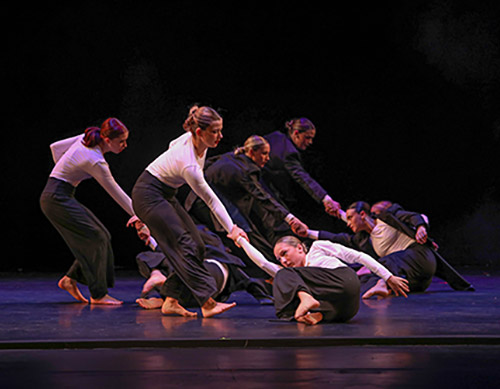 SRU students doing a performative dance on stage