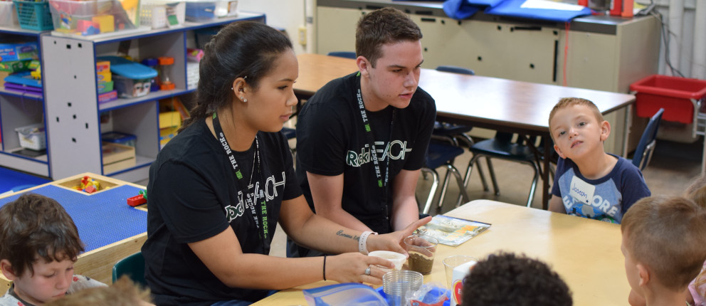 2 students teaching elementary class