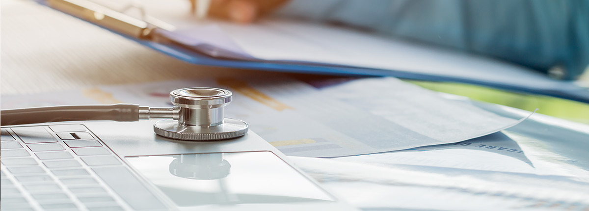 Stack of papers with stethoscope