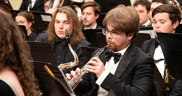 A group of musicians sitting.