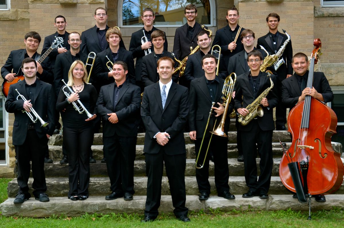 Jazz ensemble members standing on stone steps