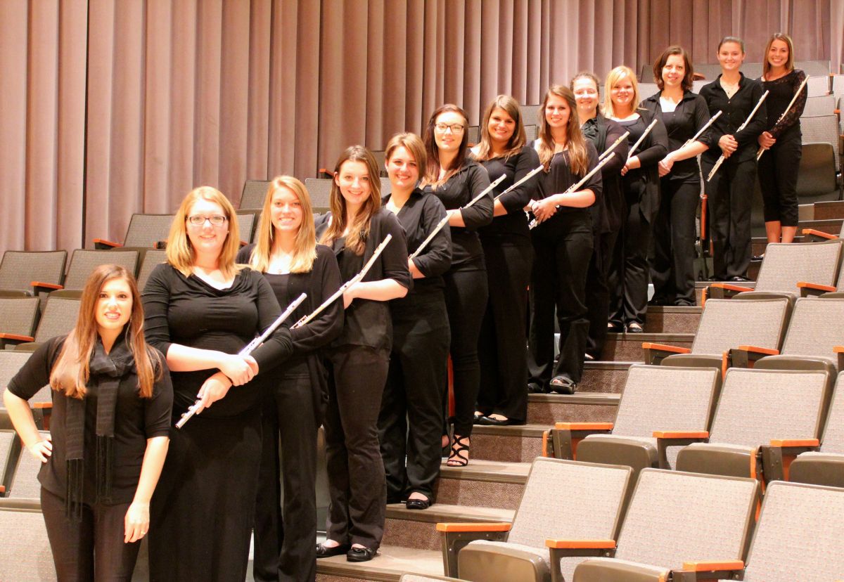 Flute choir members standing up recital hall steps