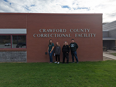 People posing with Correctional Facility