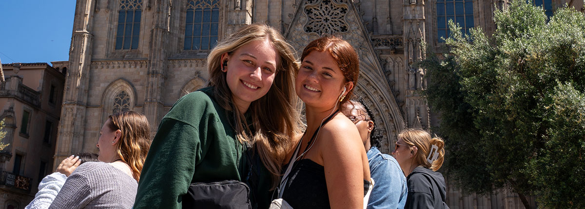 Two students smiling